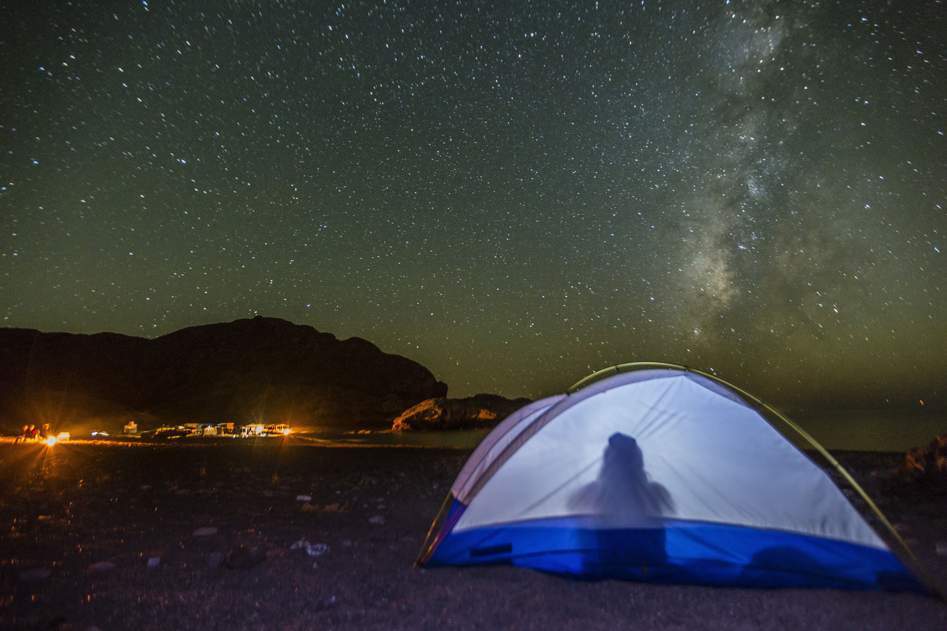 Night view of the Milky Way with lit up tent in foreground, Himalaya Beach, Sonora, Mexico, North America