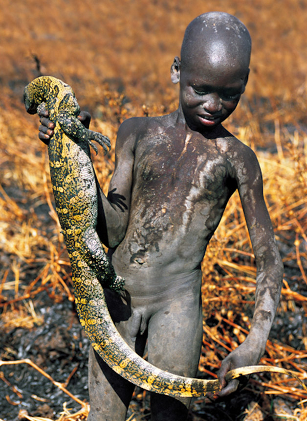 Dinka Boy with Monitor Lizard