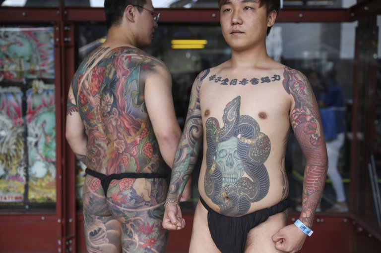 Tattoo enthusiasts, Meigin and Seoyul from South Korea, at the London Tattoo convention in Shadwell, East London. . 23 September 2016.