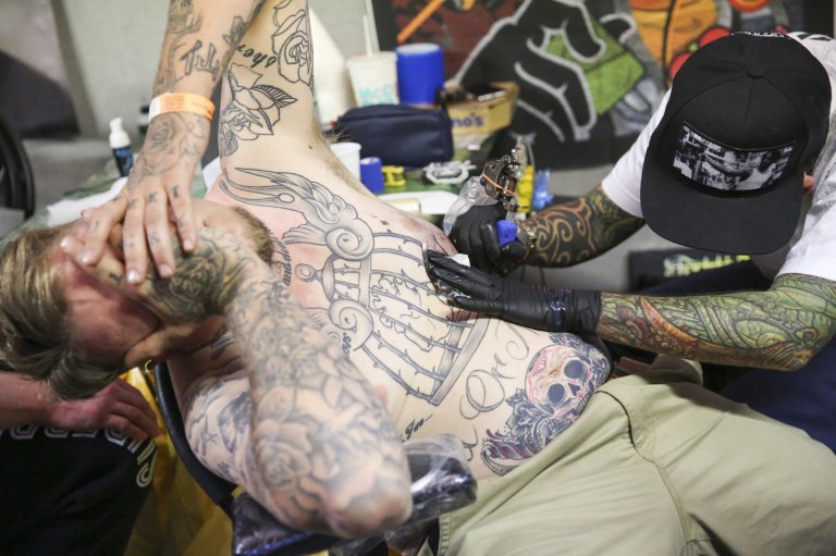 Tattooing at the London Tattoo convention in Shadwell, East London.