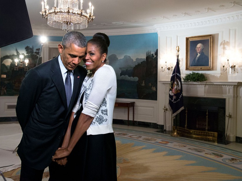 First Lady Michelle Obama snuggles against President Barack Obama before a videotaping for the 2015 World Expo, in the Diplomatic Reception Room of the White House, March 27, 2015. (Official White House Photo by Amanda Lucidon) This official White House photograph is being made available only for publication by news organizations and/or for personal use printing by the subject(s) of the photograph. The photograph may not be manipulated in any way and may not be used in commercial or political materials, advertisements, emails, products, promotions that in any way suggests approval or endorsement of the President, the First Family, or the White House.