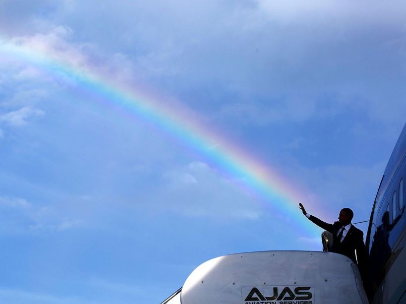 April 9, 2015 "The President's wave aligns with a rainbow as he boards Air Force One at Norman Manley International Airport prior to departure from Kingston, Jamaica. Read my Behind The Lens account of this photograph: http://bit.ly/1NMjCjHtk ." (Official White House Photo by Pete Souza) This official White House photograph is being made available only for publication by news organizations and/or for personal use printing by the subject(s) of the photograph. The photograph may not be manipulated in any way and may not be used in commercial or political materials, advertisements, emails, products, promotions that in any way suggests approval or endorsement of the President, the First Family, or the White House.