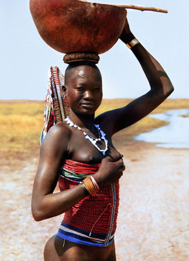 Dinka Woman with Corset Carrying Calabash