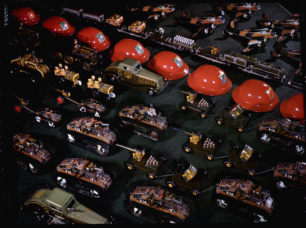 Closeups of various toys--tanks, cars, t