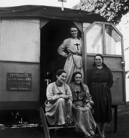 May 1960, France --- Nuns in a gypsy camp in the Rhone Valley. --- Image by © Archives Barrat-Bartoll/Corbis