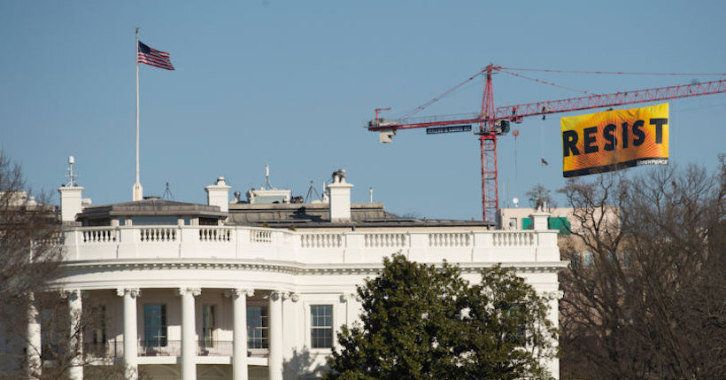 Greenpeace activists deploy a banner on a construction crane near the White House reading "RESIST" on President Trump's fifth day in office.The activists are calling for those who want to resist Trump's attacks on environmental, social, economic and educational justice to contribute to a better America.